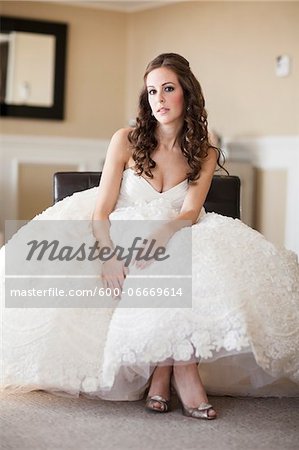 Portrait of Bride sitting in Hotel Room