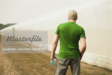 Back View of Mature Man with Water Bottle after Running, Lampertheim, Hesse, Germany