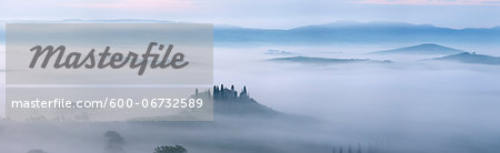 Typical Tuscany landscape in morning with fog, in foreground is Podere Belvedere a farm near San Quirico d'Orcia. Val d'Orcia, Orcia Valley, Siena district, Tuscany, Toscana, Italy. Typical Tuscany landscape in morning with fog, in foreground is Podere Belvedere a farm near San Quirico d'Orcia. Val d'Orcia, Orcia Valley, Siena district, Tuscany, Toscana, Italy.