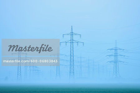 Power lines in early morning fog, Hesse, Germany, Europe