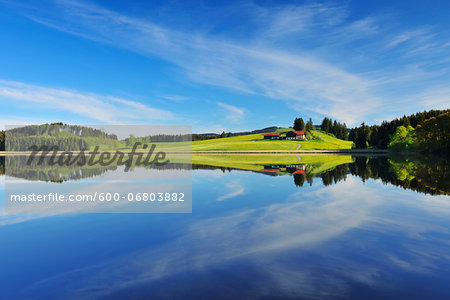 Landscape and Sky Reflecting in Lake, Sameister Weiher, Rosshaupten, Bavaria, Germany
