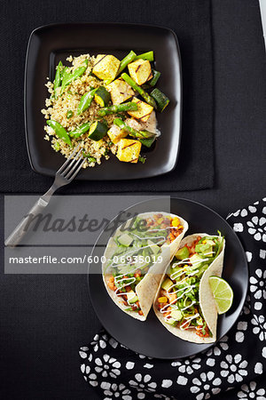 Overhead View of Quinoa with Zucchini, Asparagus and Tofu and Tacos with Bean Mix and Avocado, Studio Shot