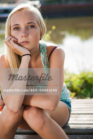 Portrait of teenage girl outdoors, looking at camera, Germany