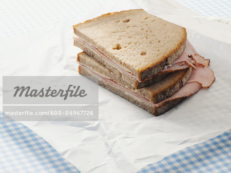 Close-up of Ham Sandwich on Parchment Paper