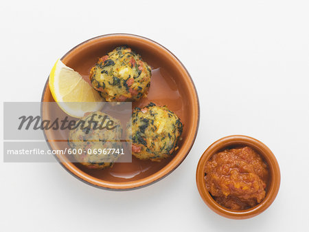 Fried Potatao Balls with Lemon Wedge and Bowl of Salsa, Studio Shot