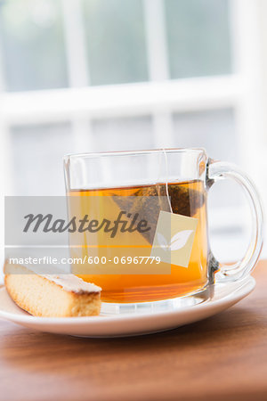 Cup of Tea in Clear Mug with Lemon Biscotti, Studio Shot