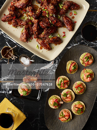 Overhead View of Appetizers, Chicken Wings and Crostini, Studio Shot Overhead View of Appetizers, Chicken Wings and Crostini, Studio Shot