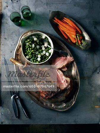 Overhead View of Roast Lamb with Carrots and Peas, Studio Shot Overhead View of Roast Lamb with Carrots and Peas, Studio Shot