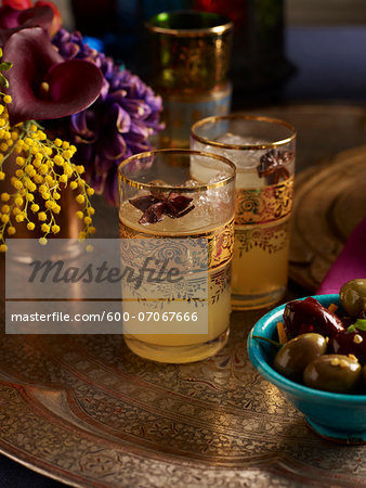 Cocktails with Star Anise Garnish and Bowl of Olives, Studio Shot