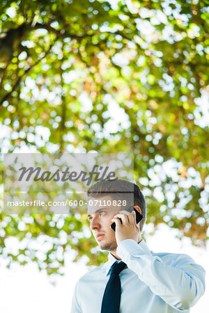 Businessman using Cell Phone Outdoors, Mannheim, Baden-Wurttemberg, Germany