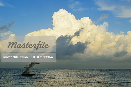 Diving board and storm clouds at Rhodes City beach, Rhodes, Dodecanese, Aegean Sea, Greece, Europe