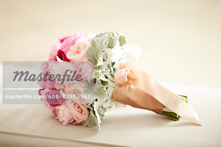 Close-up of bridal bouquet wrapped in ribbon, studio shot