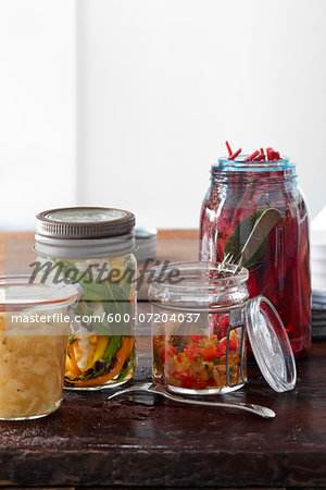 Multiple Jars of Homemade Pickled Vegetable Relish and Salsa