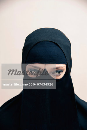 Premium Photo  Young woman with black face paint on a black background