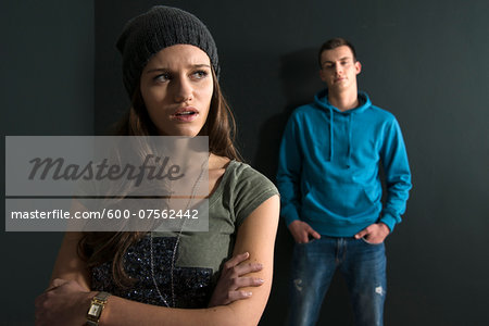 Teenage Girl and Young Man Arguing, Studio Shot Teenage Girl and Young Man Arguing, Studio Shot