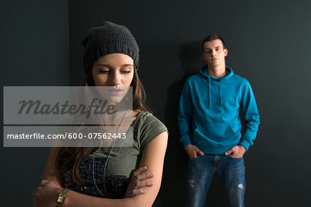 Teenage Girl and Young Man Arguing, Studio Shot Teenage Girl and Young Man Arguing, Studio Shot