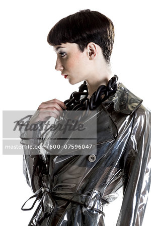 Portrait of Young Woman wearing Rain Jacket and Modern Jewellery, Studio Shot