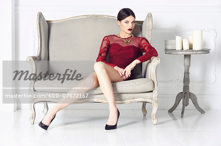 Portrait of Young Woman Sitting on Chair Portrait of Young Woman Sitting on Chair