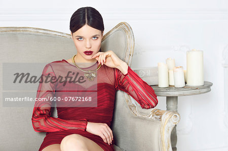Portrait of Young Woman Sitting on Chair Portrait of Young Woman Sitting on Chair