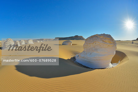 Sun over Rock Formations in White Desert, Libyan Desert, Sahara Desert, New Valley Governorate, Egypt Sun over Rock Formations in White Desert, Libyan Desert, Sahara Desert, New Valley Governorate, Egypt