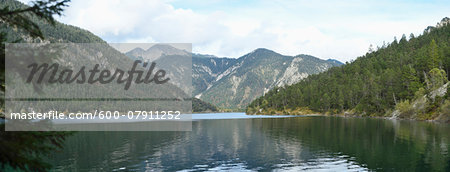 Scenic view of mountains and a clear lake (Plansee) in autumn, Tirol, Austria