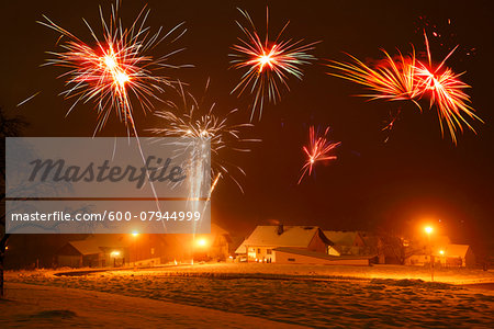 Celebrating New Year's Eve with Fireworks in Village, Bavaria, Germany