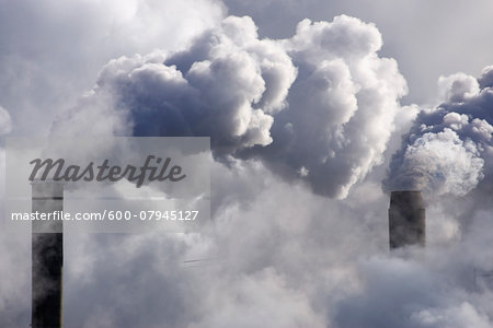Close-up of smoke stacks at Kruger Inc., one of Canada's largest paper mills, Trois-Rivieres, Quebec, Canada Close-up of smoke stacks at Kruger Inc., one of Canada's largest paper mills, Trois-Rivieres, Quebec, Canada