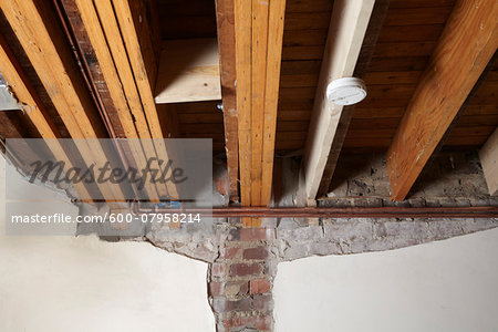 Copper Pipes And Ceiling Joists Of Home Under Construction