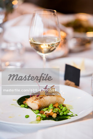 Cod with Lima Beans and Glass of White Wine at Wedding Reception Cod with Lima Beans and Glass of White Wine at Wedding Reception