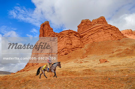 Cowboy Riding Horse, Wyoming, USA