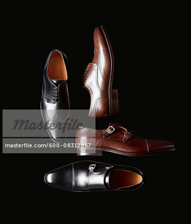 Men's leather shoes on black background in studio