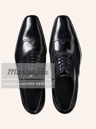 Pair of black leather shoes, studio shot on white background