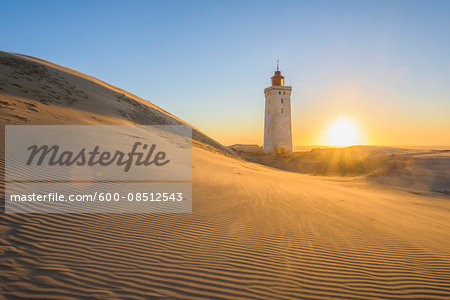 Lighthouse and Dunes, Rubjerg Knude at Sunset, Lokken, North Jutland, Denmark Lighthouse and Dunes, Rubjerg Knude at Sunset, Lokken, North Jutland, Denmark
