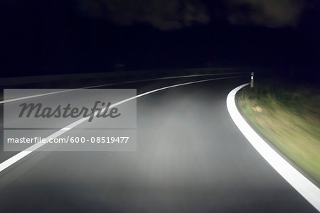 View from Moving Car at Night on Curvy Road, Germany