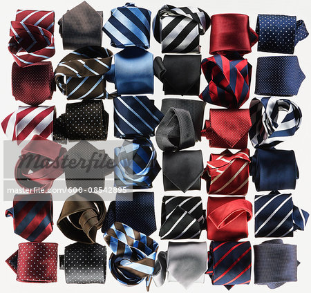 Group of necktie roled-up on white background