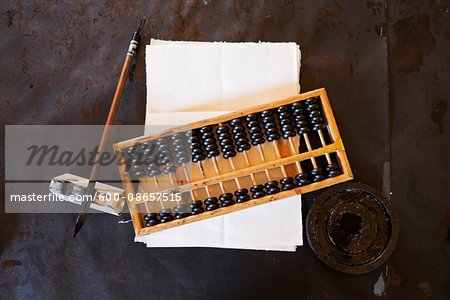 Abacus, fountain pen and parchment paper at Chinese School in Barkerville Historic Town in British Columbia, Canada