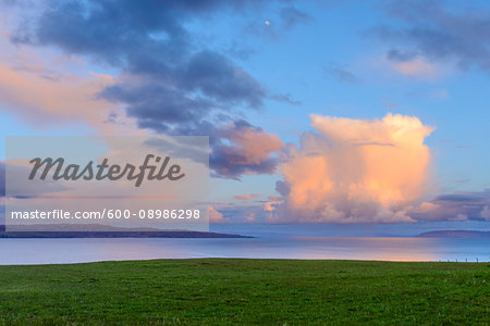 Cumulonimbus clouds at sunset over the ocean at the Isle of Sky in Scotland, Isle of Skye, Scotland, United Kingdom