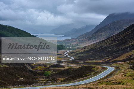 Winding highway through the typical Scottish countryside in the highlands of Scotland, United Kingdom