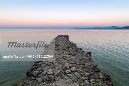 Angler jetty on Lake Garda (Lago di Garda) at dawn in Garda in Veneto, Italy Angler jetty on Lake Garda (Lago di Garda) at dawn in Garda in Veneto, Italy
