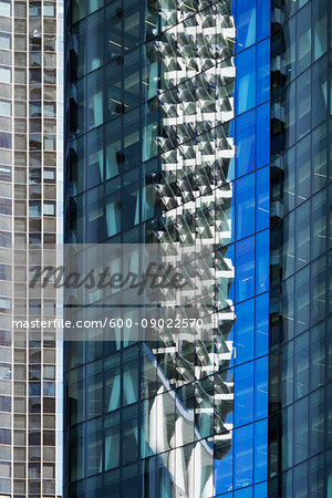 Close-up of reflections in glass windows of office buildings in Brisbane, Australia