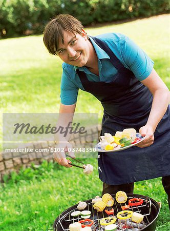 A man by a grill.