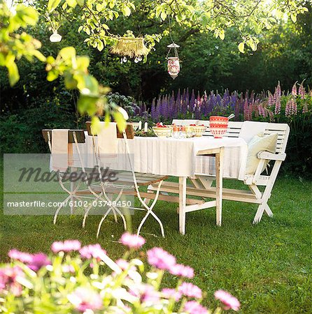 A set table in a garden.