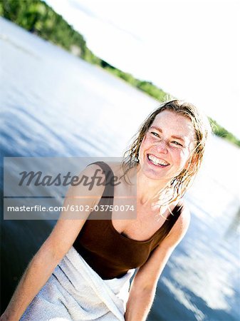 A woman by a lake.