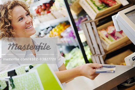 A woman buying food, Sweden.