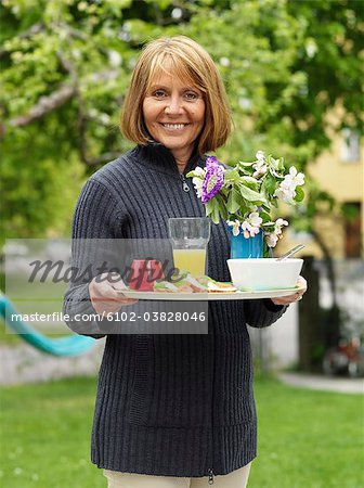Portrait of a woman in a garden, Sweden.