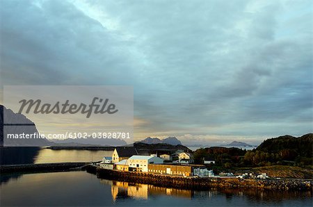 Ocean view and the midnight sun, Henningsvaer, Lofoten islands, Norway.