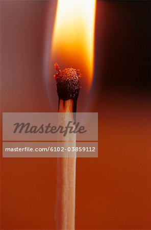 Close-up of flaming match stick
