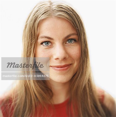 Portrait of a smiling woman against white background