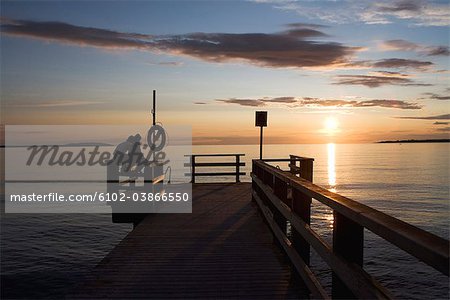 A couple watching the sunset, Skane, Sweden.