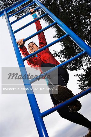 Woman climbing on ladder